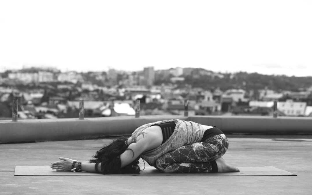 Woman demonstrating pelvic floor stretch exercise position for endometriosis pain relief and muscle relaxation