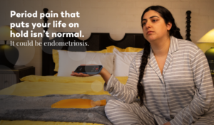 Frustrated woman in striped pajamas waiting for endometriosis diagnosis