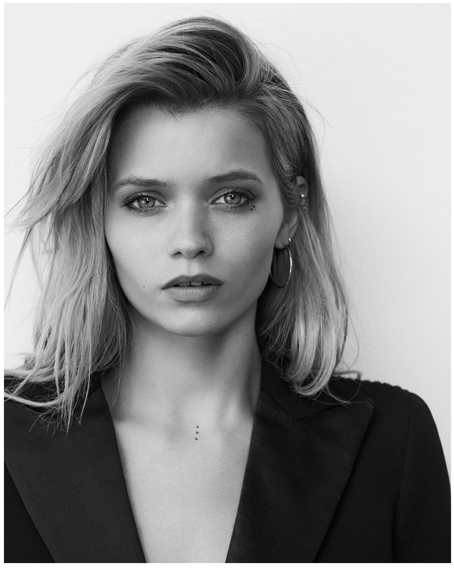 Abbey Lee, Endometriosis Australia ambassador, in black and white portrait wearing black blazer